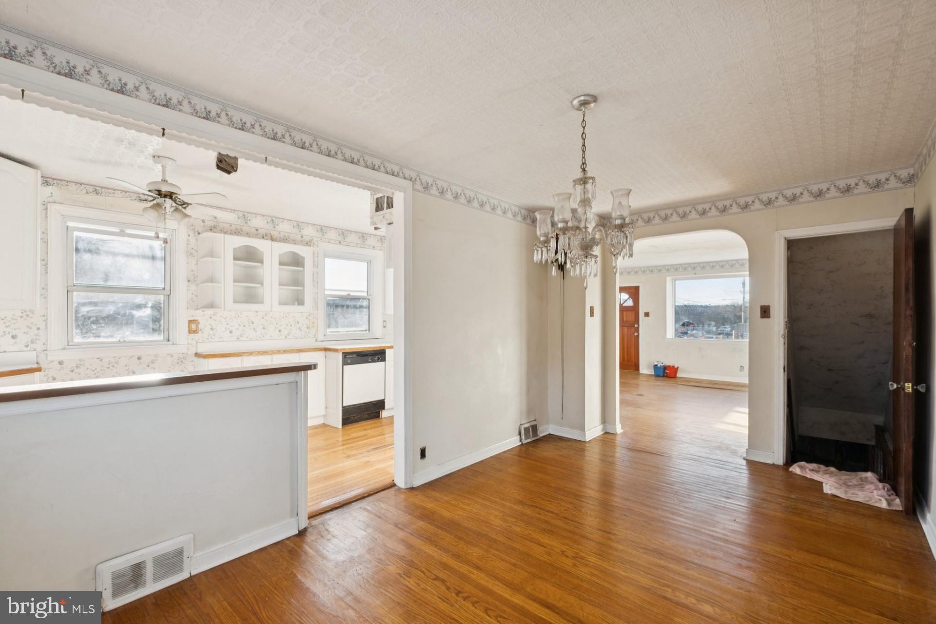 3051 Gilham Street Philadelphia, PA 19149 - Photo 7 of 10 a view of a big room with wooden floor and windows