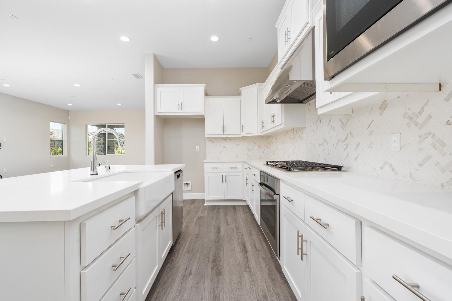 272 Peters Road Madera, CA 93636 - Photo 9 of 25 a kitchen with white cabinets appliances and sink