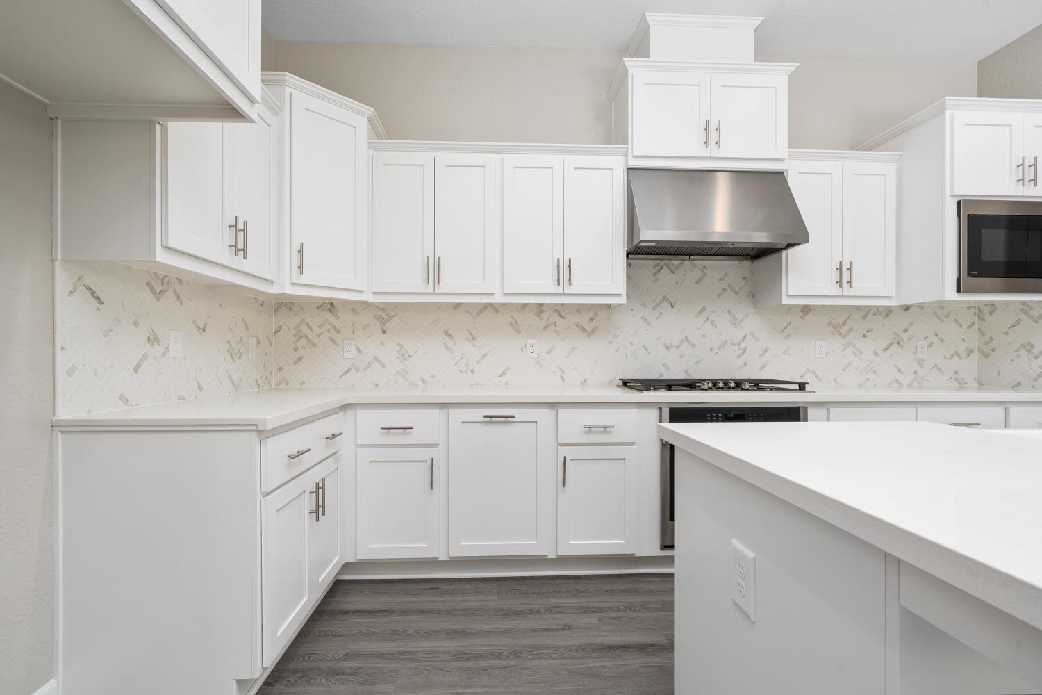 272 Peters Road Madera, CA 93636 - Photo 10 of 25 a kitchen with stainless steel appliances white cabinets and a sink