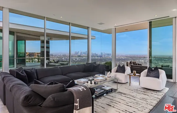 a view of a terrace with couches and city view