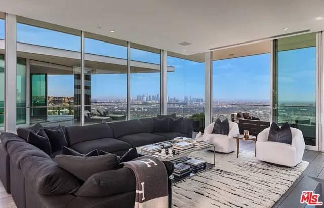 a view of a terrace with couches and city view