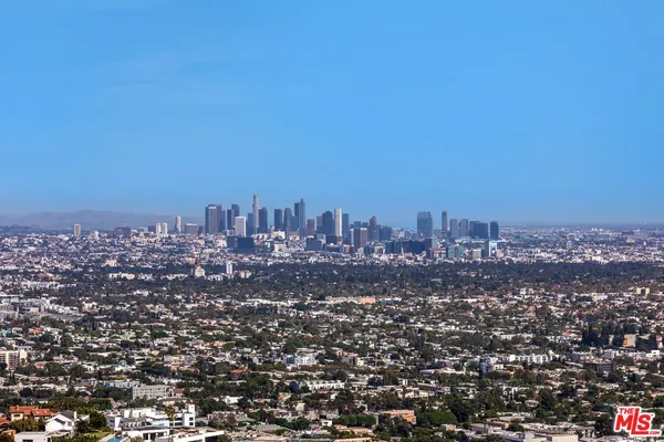 a view of a terrace with couches and pool