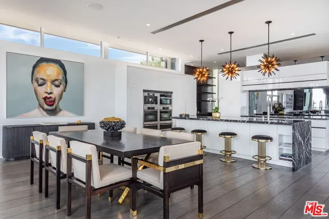 a kitchen with lots of counter and windows