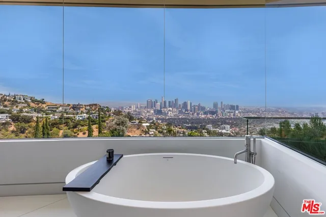a view of living room with a sink and chandelier