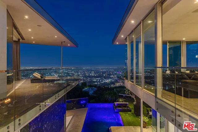a view of a livingroom with furniture and windows
