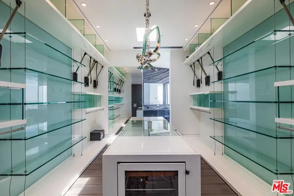 a bedroom with a bed and a view of balcony