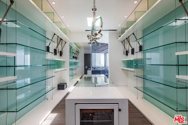 a bedroom with a bed and a view of balcony