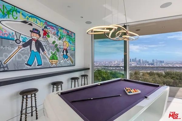 a view of a living room and floor to ceiling window