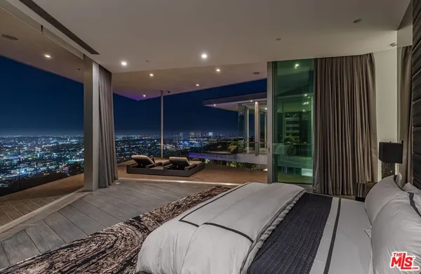 a outdoor sitting area with swimming pool