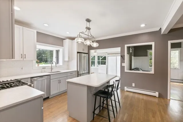 a large kitchen with a table and chairs