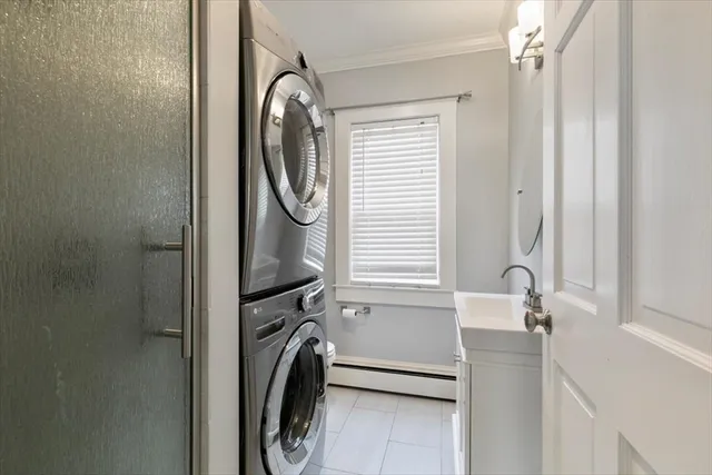 a bathroom with a sink a washer and dryer