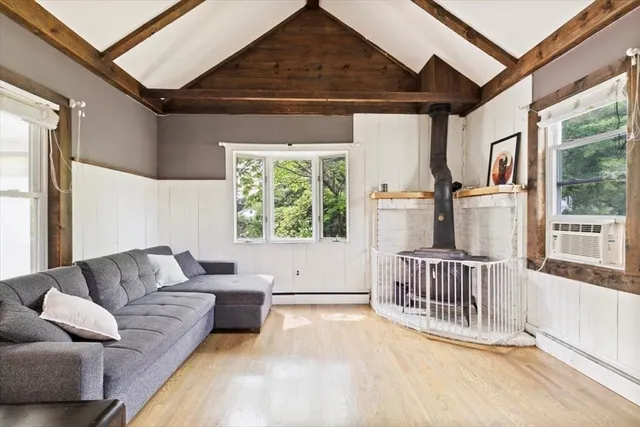 a balcony with furniture and a potted plant