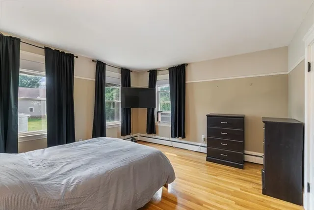 a bedroom with a bed and a dresser