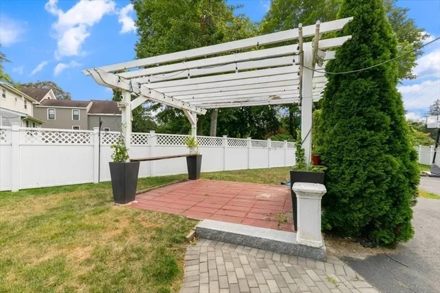 a view of a chair and table in the garden