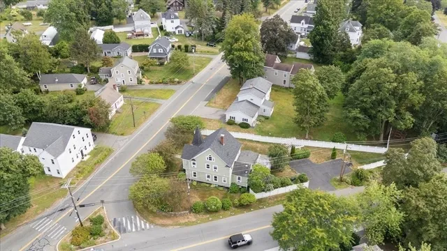 an aerial view of a house with a lake view