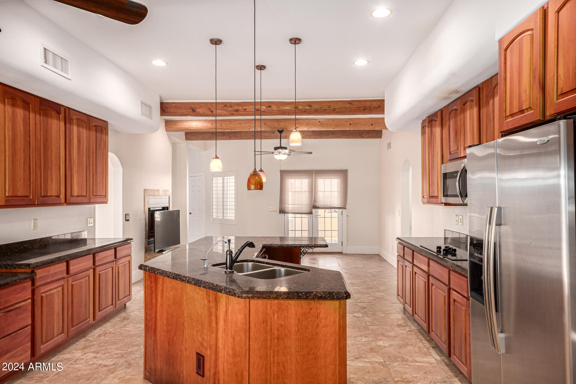 10589 West Harmon Road Eloy, AZ 85131 - Photo 28 of 82 a kitchen with stainless steel appliances granite countertop a sink a stove and a refrigerator