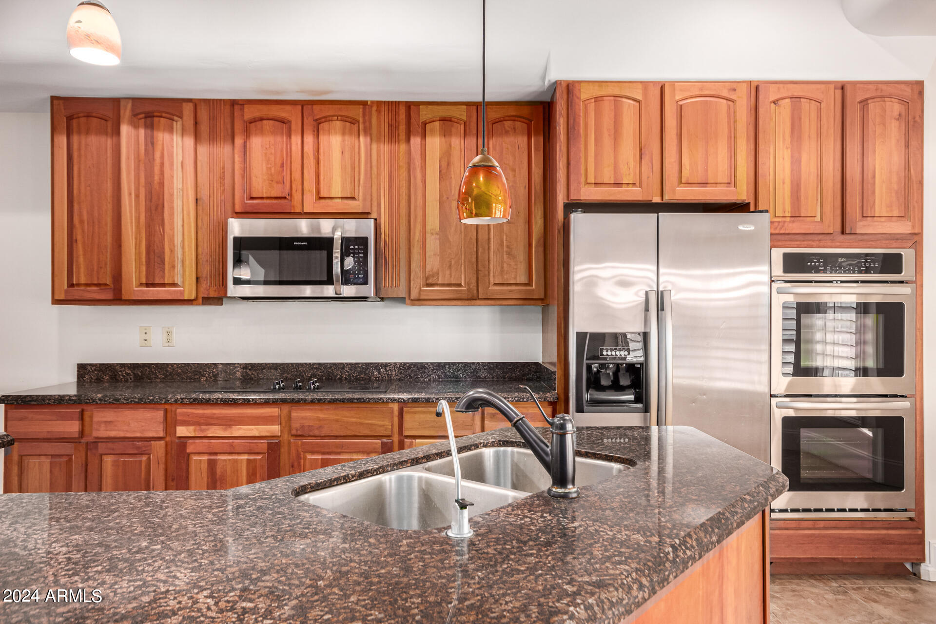 10589 West Harmon Road Eloy, AZ 85131 - Photo 31 of 82 a kitchen with stainless steel appliances granite countertop a refrigerator a stove top oven a sink and dishwasher