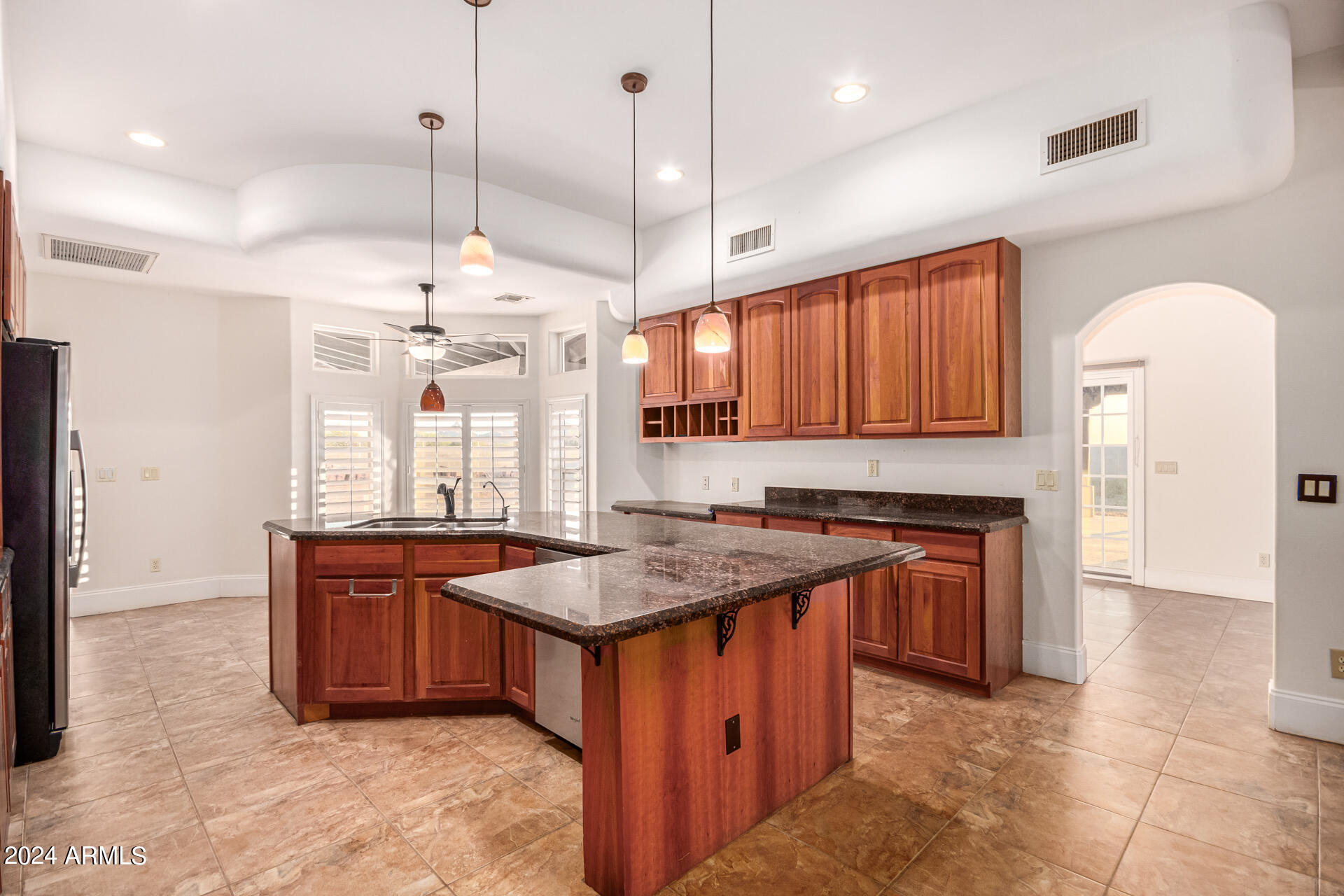 10589 West Harmon Road Eloy, AZ 85131 - Photo 34 of 82 a kitchen with a stove a sink a counter space and a window