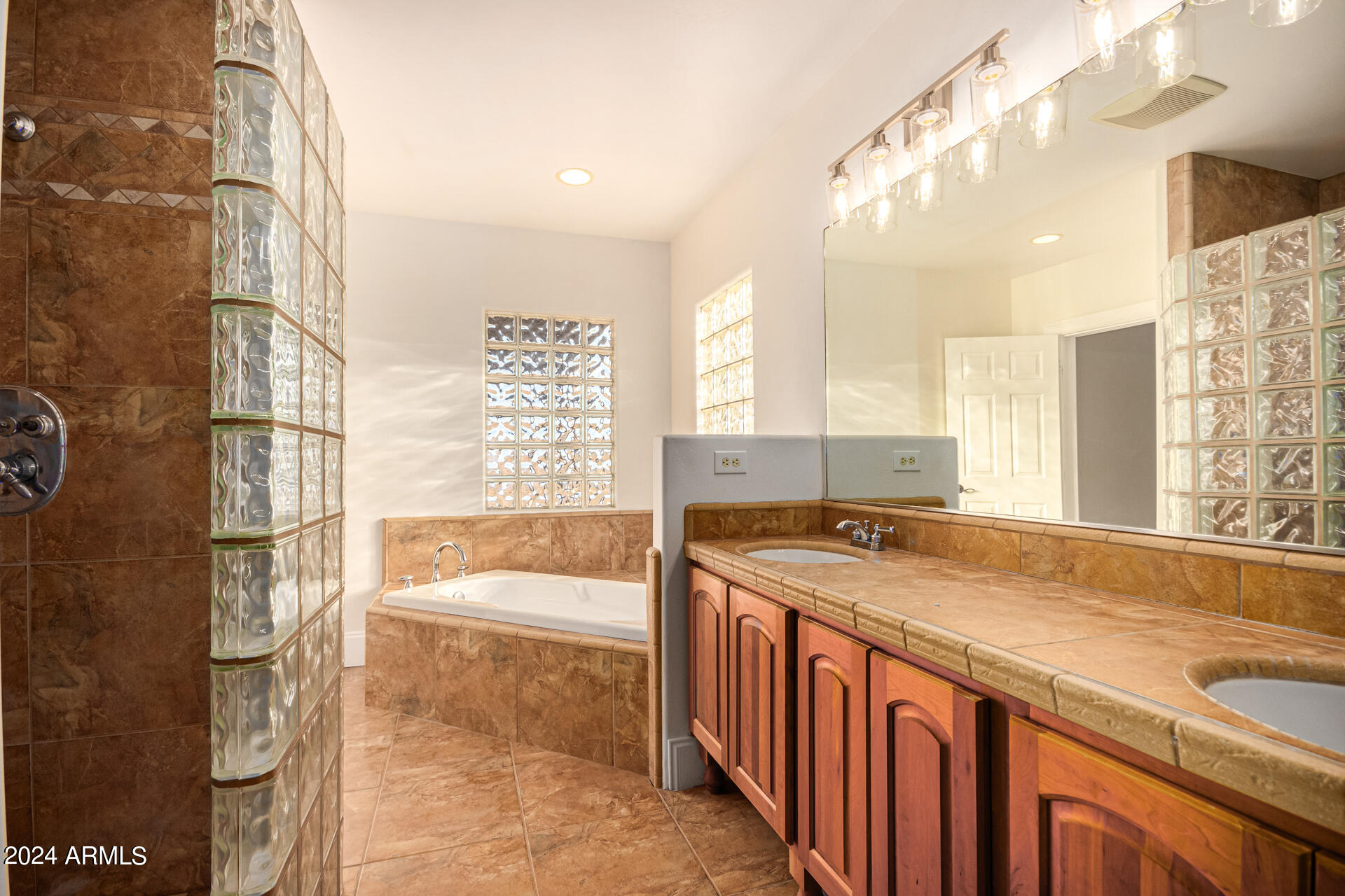 10589 West Harmon Road Eloy, AZ 85131 - Photo 43 of 82 a bathroom with a granite countertop sink and a bathtub