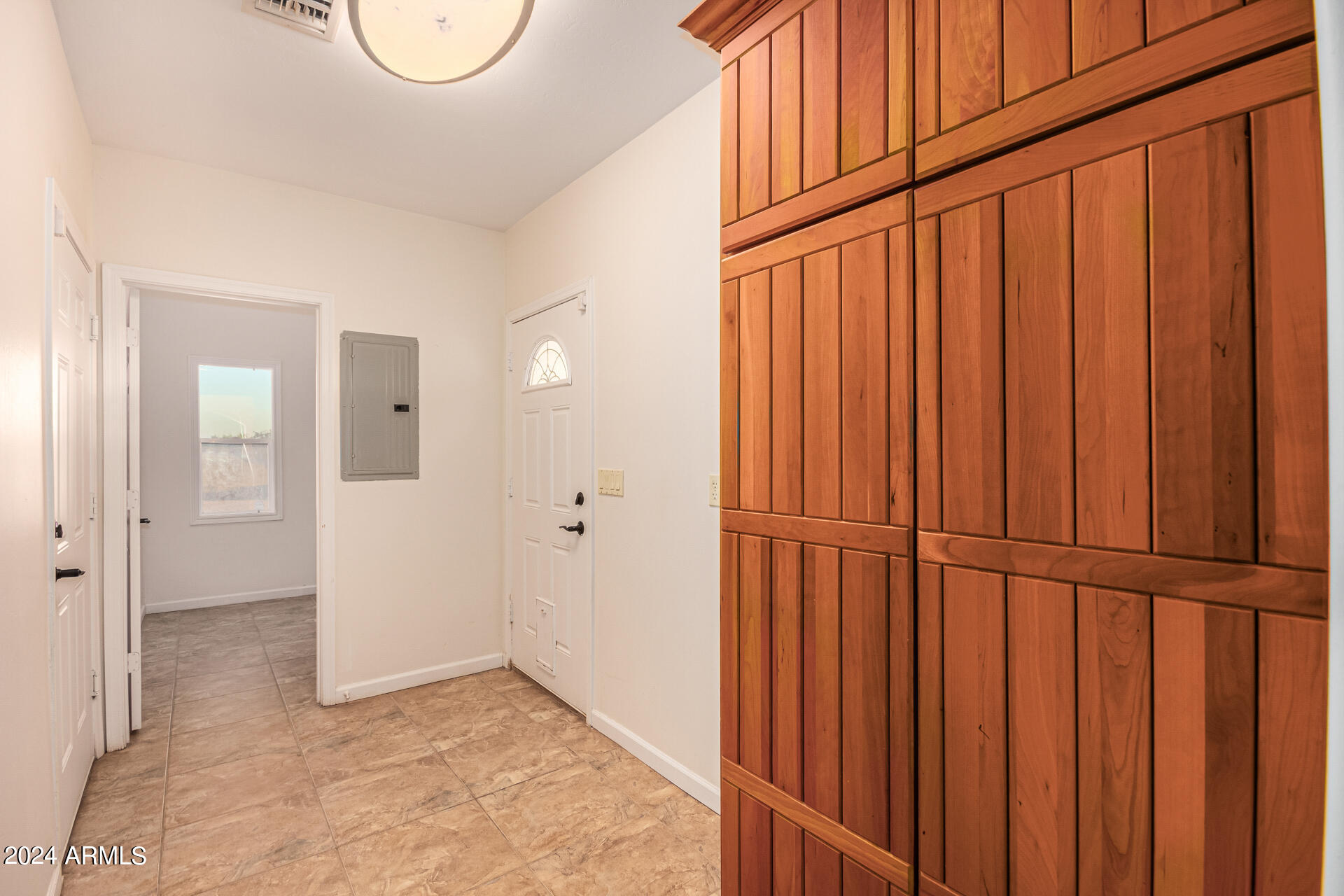 10589 West Harmon Road Eloy, AZ 85131 - Photo 52 of 82 a view of a closet with wooden floor