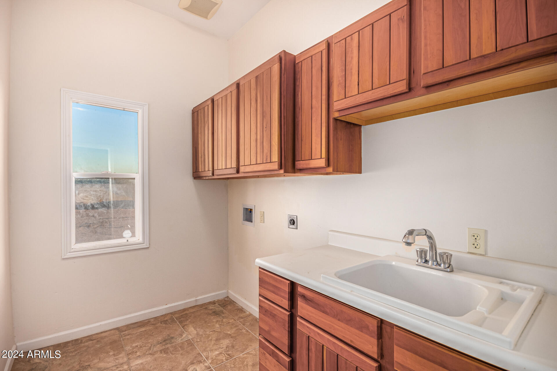 10589 West Harmon Road Eloy, AZ 85131 - Photo 54 of 82 a kitchen with stainless steel appliances granite countertop a sink dishwasher stove and cabinets