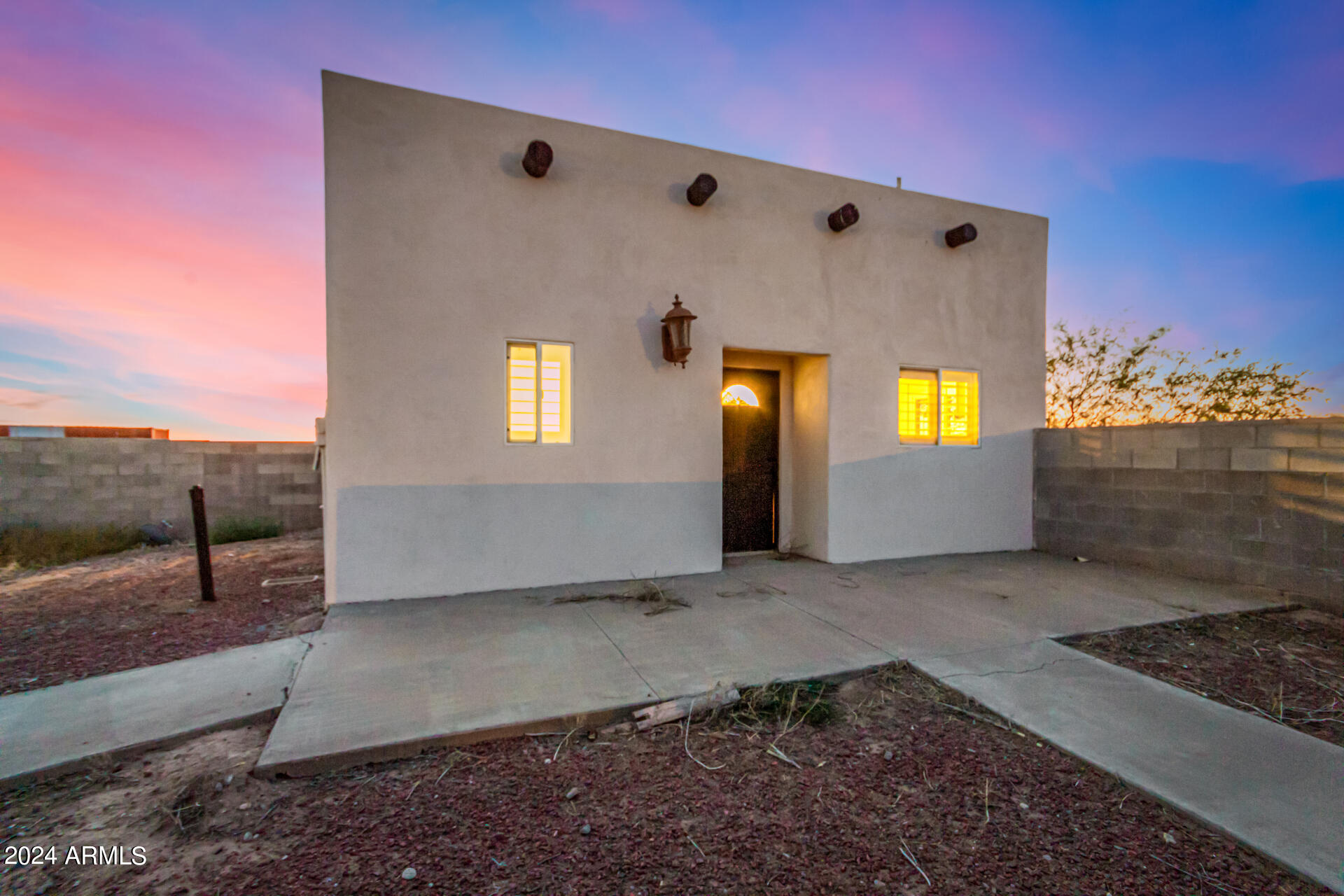 10589 West Harmon Road Eloy, AZ 85131 - Photo 65 of 82 a view of an empty room with a fireplace and a window