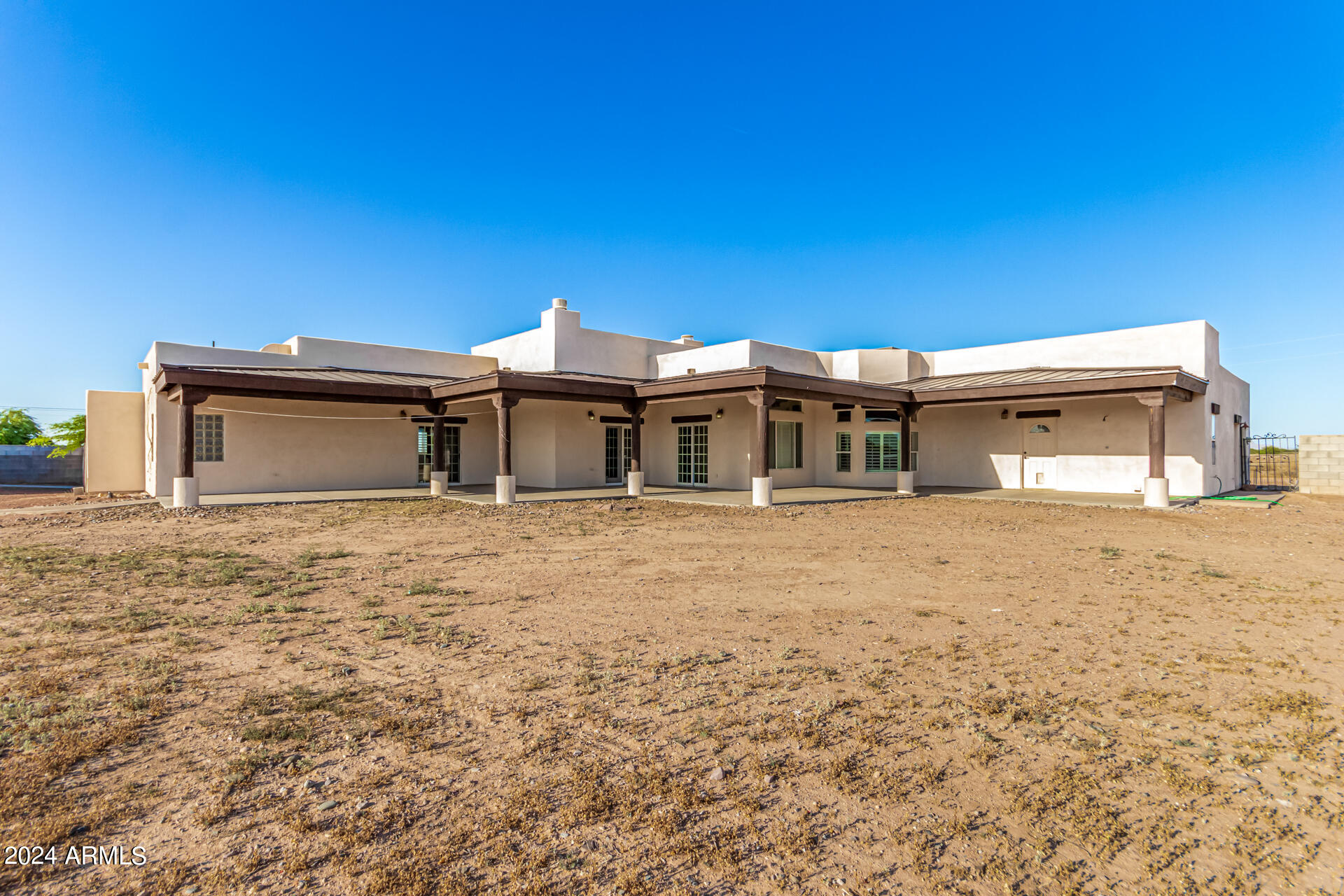 10589 West Harmon Road Eloy, AZ 85131 - Photo 70 of 82 a front view of a house with a garden