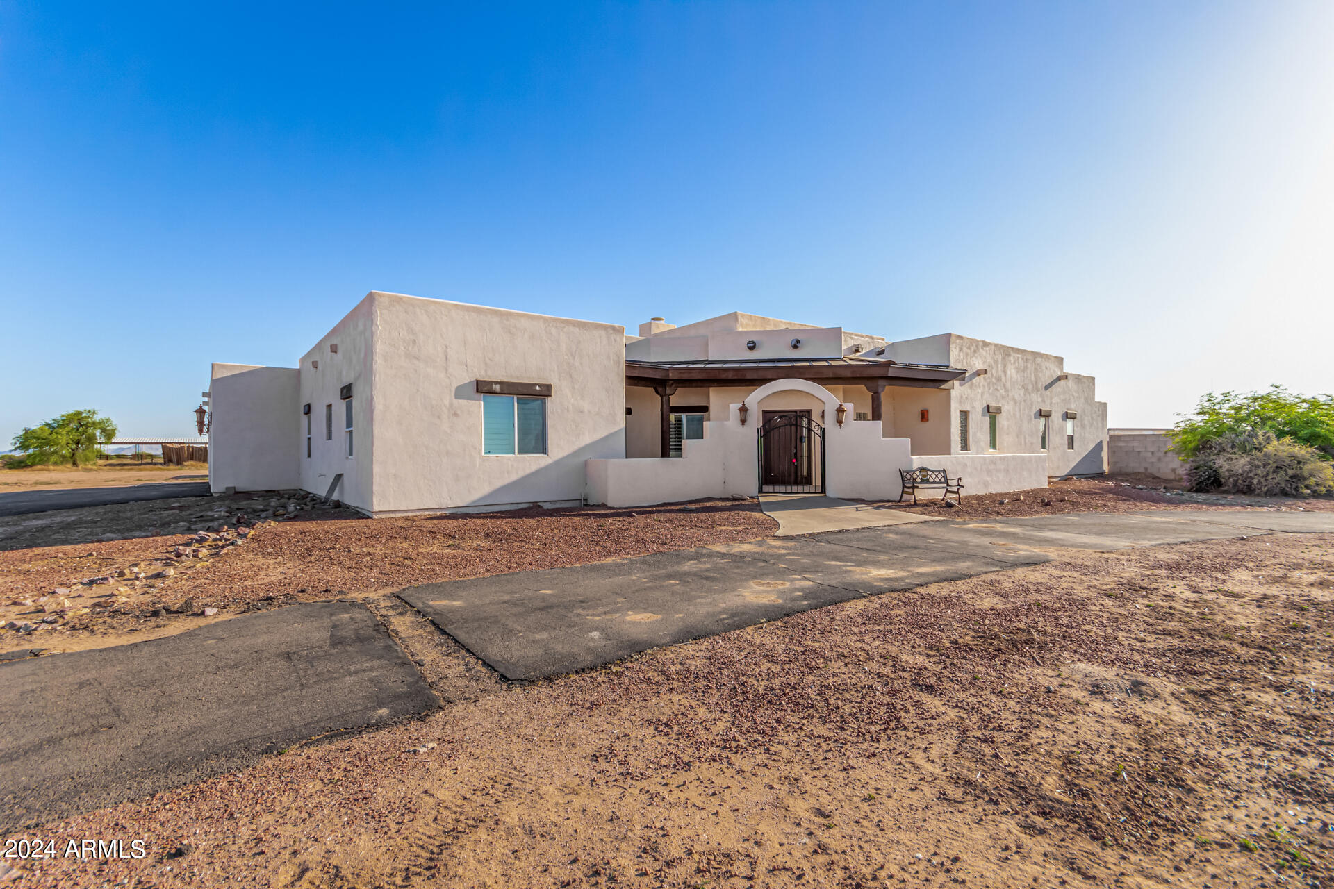 10589 West Harmon Road Eloy, AZ 85131 - Photo 7 of 82 a view of a house with backyard and trees