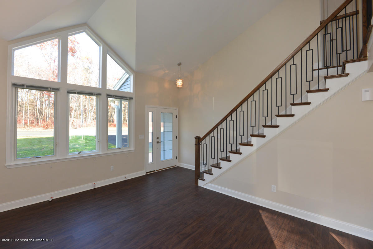 93 Friendship Road Howell, NJ 07731 - Photo 11 of 51 a view of an entryway with wooden floor and windows