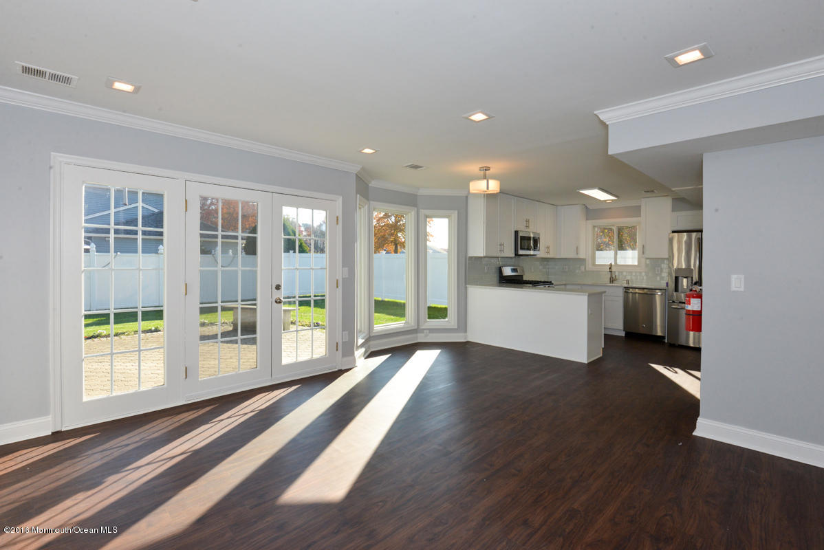 93 Friendship Road Howell, NJ 07731 - Photo 16 of 51 a view of a kitchen with a sink and a large window