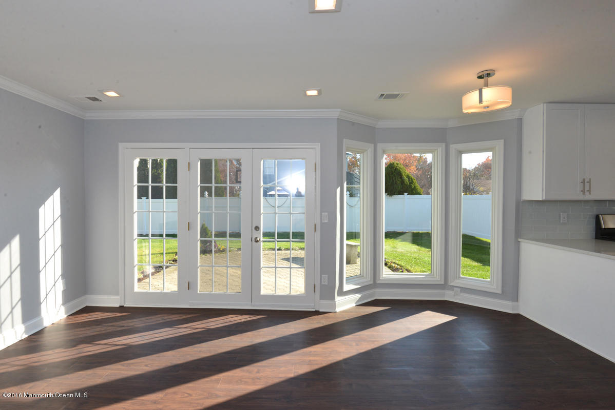 93 Friendship Road Howell, NJ 07731 - Photo 17 of 51 a view of empty room with wooden floor and fan