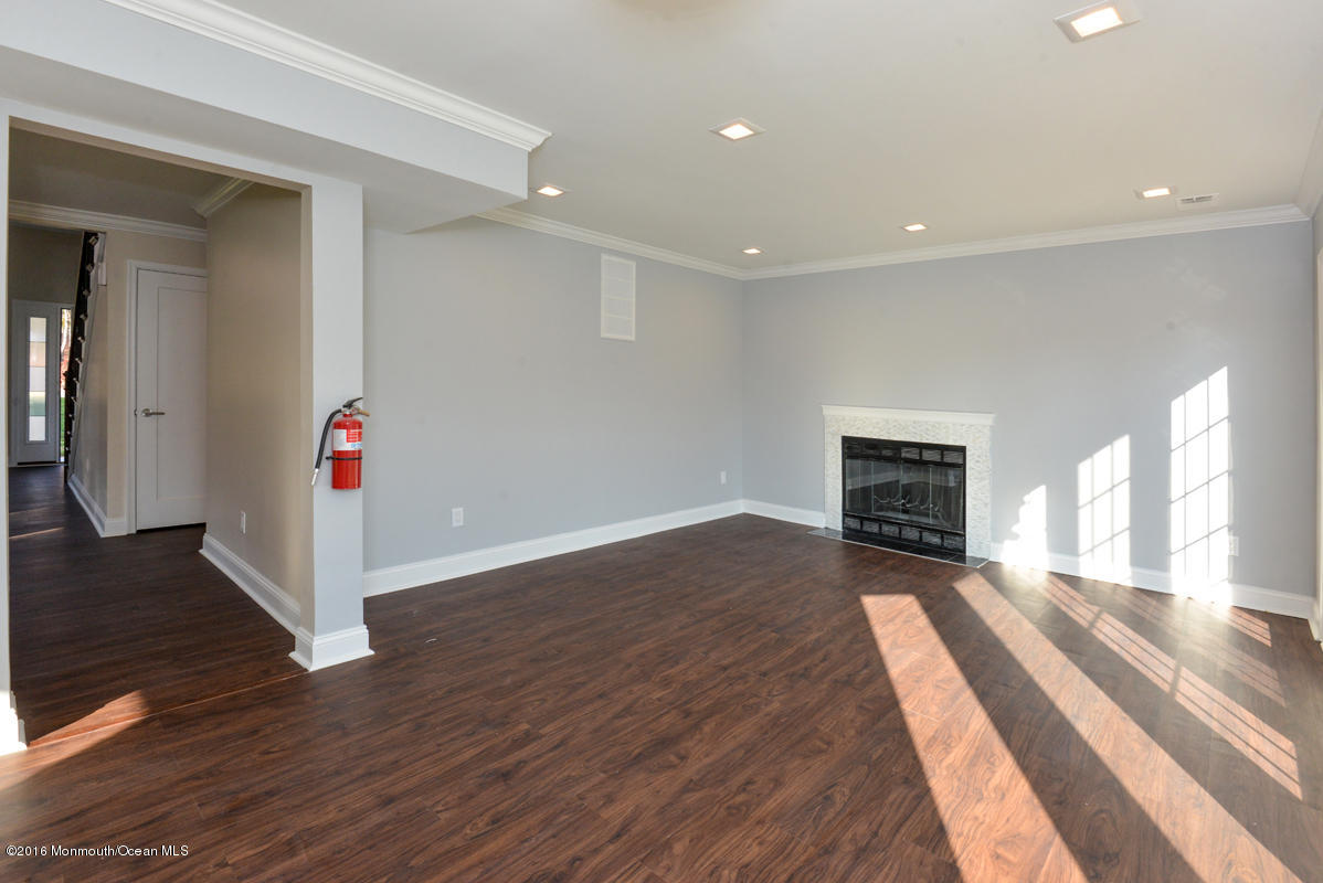 93 Friendship Road Howell, NJ 07731 - Photo 19 of 51 a view interior of the house with wooden floor and fireplace