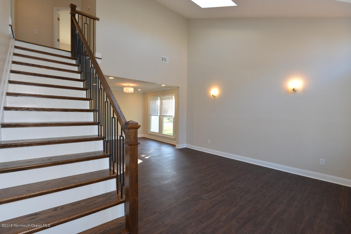 93 Friendship Road Howell, NJ 07731 - Photo 2 of 51 a view of a room with wooden floor and stairs