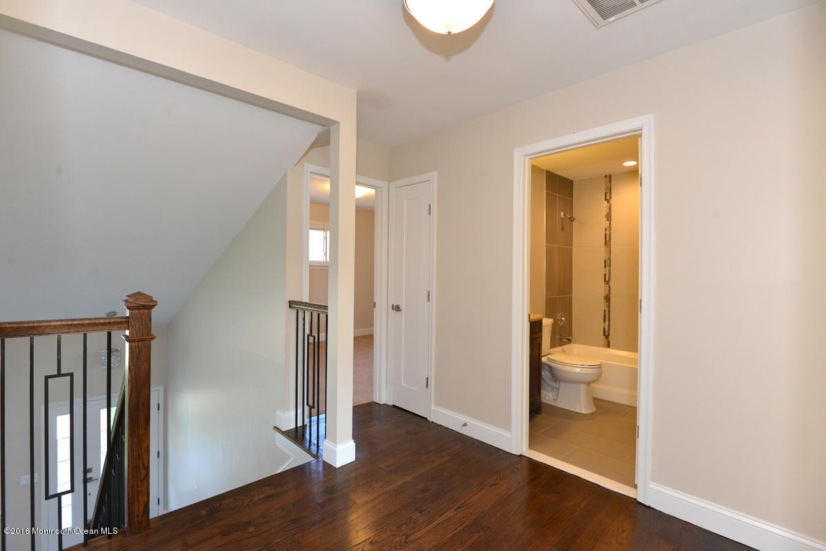 93 Friendship Road Howell, NJ 07731 - Photo 23 of 51 a bathroom with a toilet and a sink