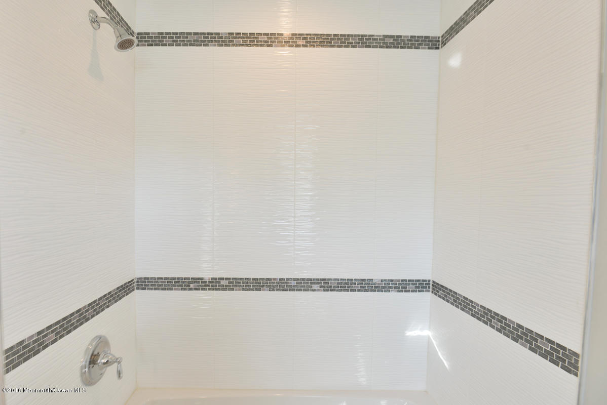 93 Friendship Road Howell, NJ 07731 - Photo 32 of 51 a bathroom with a shower and a view of shower