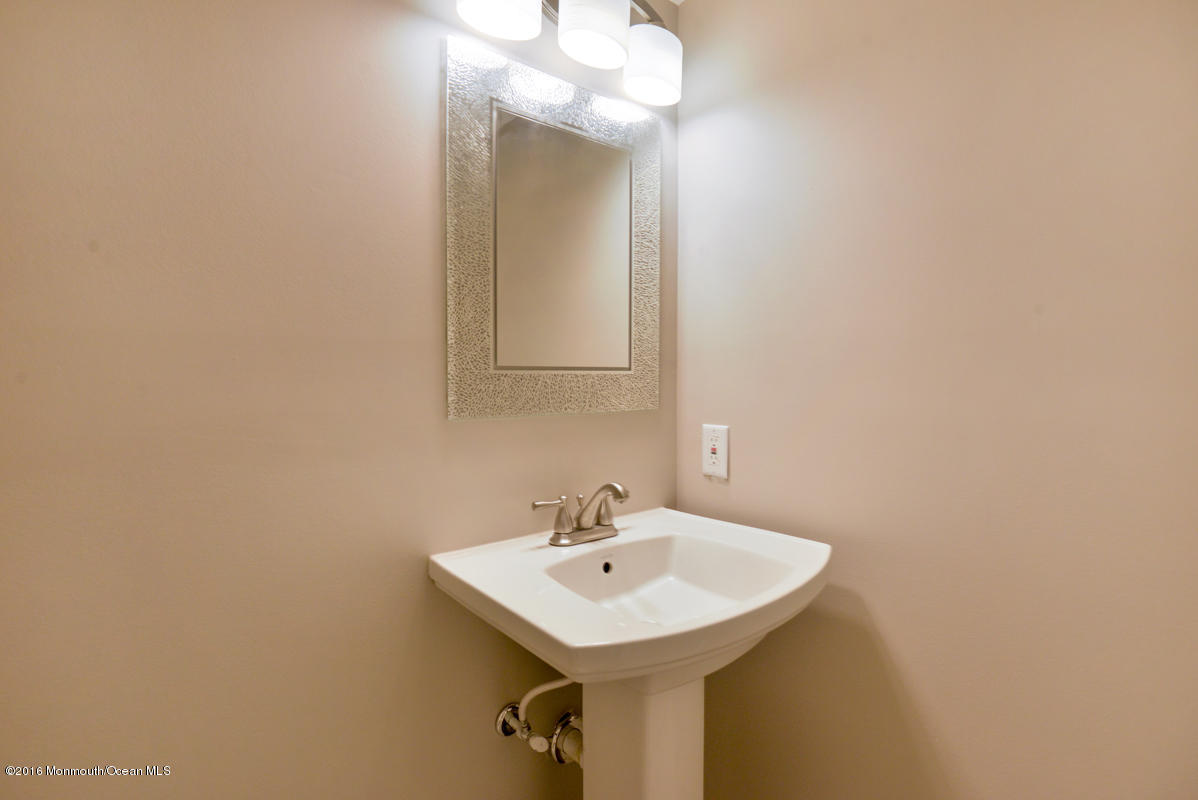 93 Friendship Road Howell, NJ 07731 - Photo 41 of 51 a bathroom with a sink and a mirror