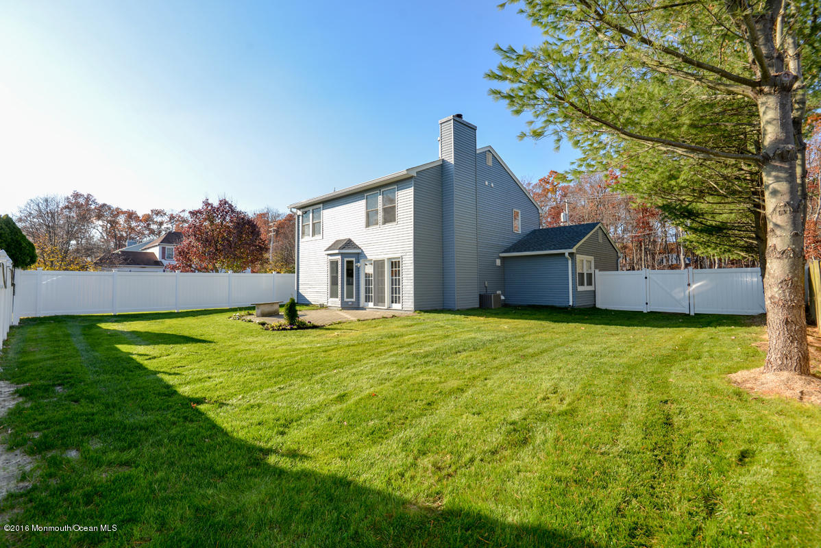93 Friendship Road Howell, NJ 07731 - Photo 45 of 51 a bathroom with a sink and garden