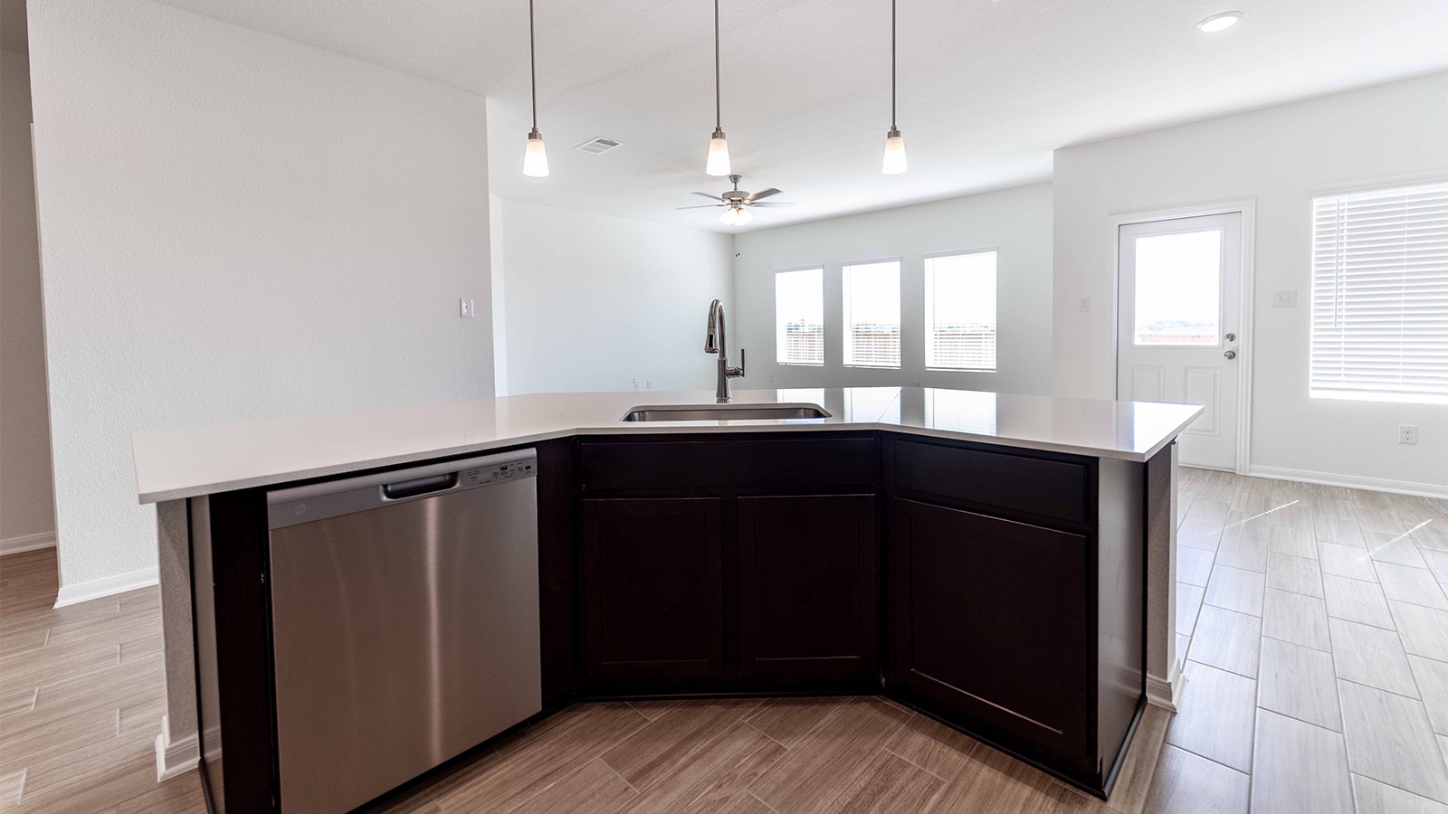 13613 Endless Narrow Lane Elgin, TX 78621 - Photo 3 of 16 a kitchen with a sink a refrigerator and window