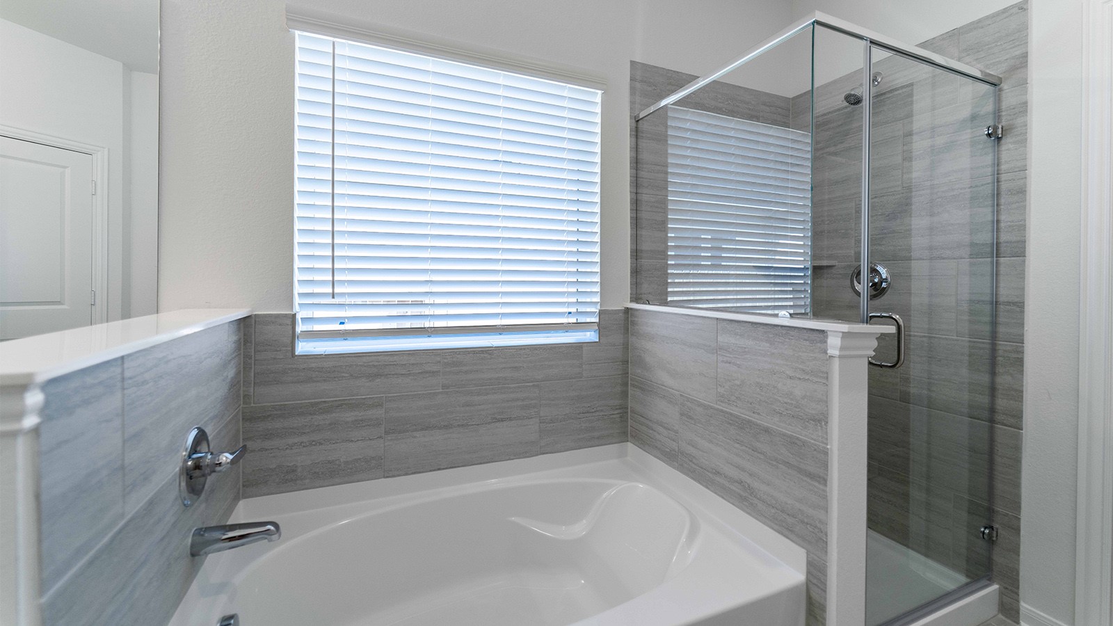 13613 Endless Narrow Lane Elgin, TX 78621 - Photo 8 of 16 a bathroom with a bathtub and shower