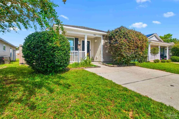 front view of a house with a yard