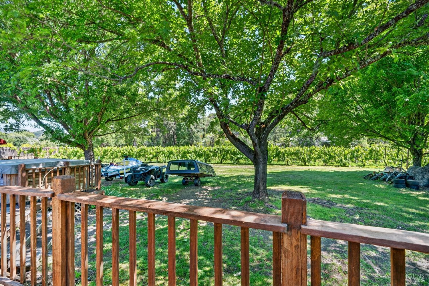 810 McNab Ranch Road Ukiah, CA 95482 - Photo 23 of 32 a view of a deck with a big yard potted plants and large tree