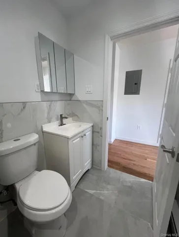 a bathroom with a sink toilet and vanity