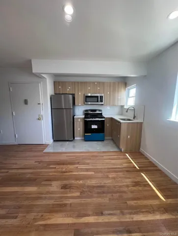 a view of kitchen and wooden floor