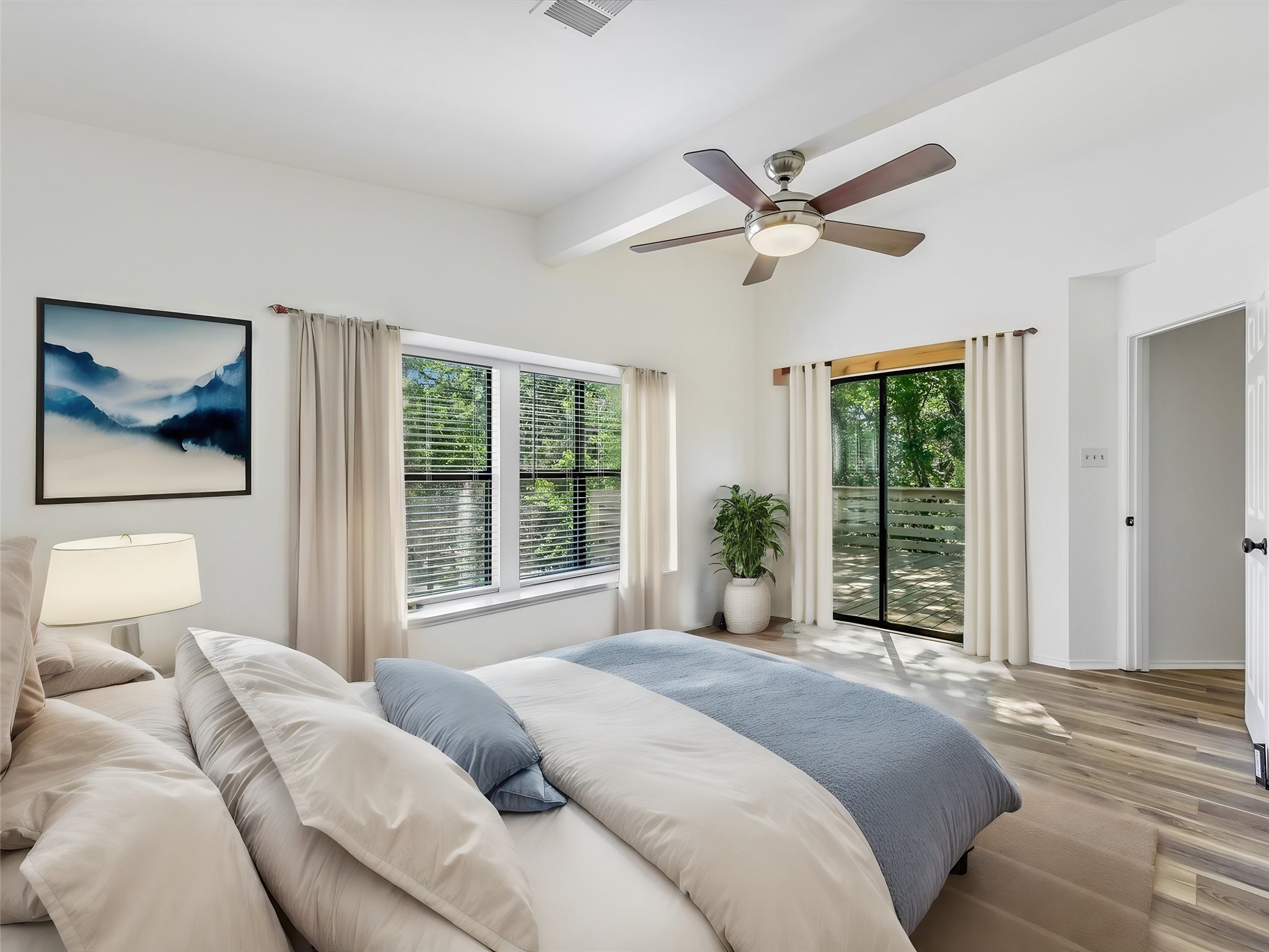 2712 Geronimo Trail Austin, TX 78734 - Photo 16 of 31 a bedroom with a large bed and a large window