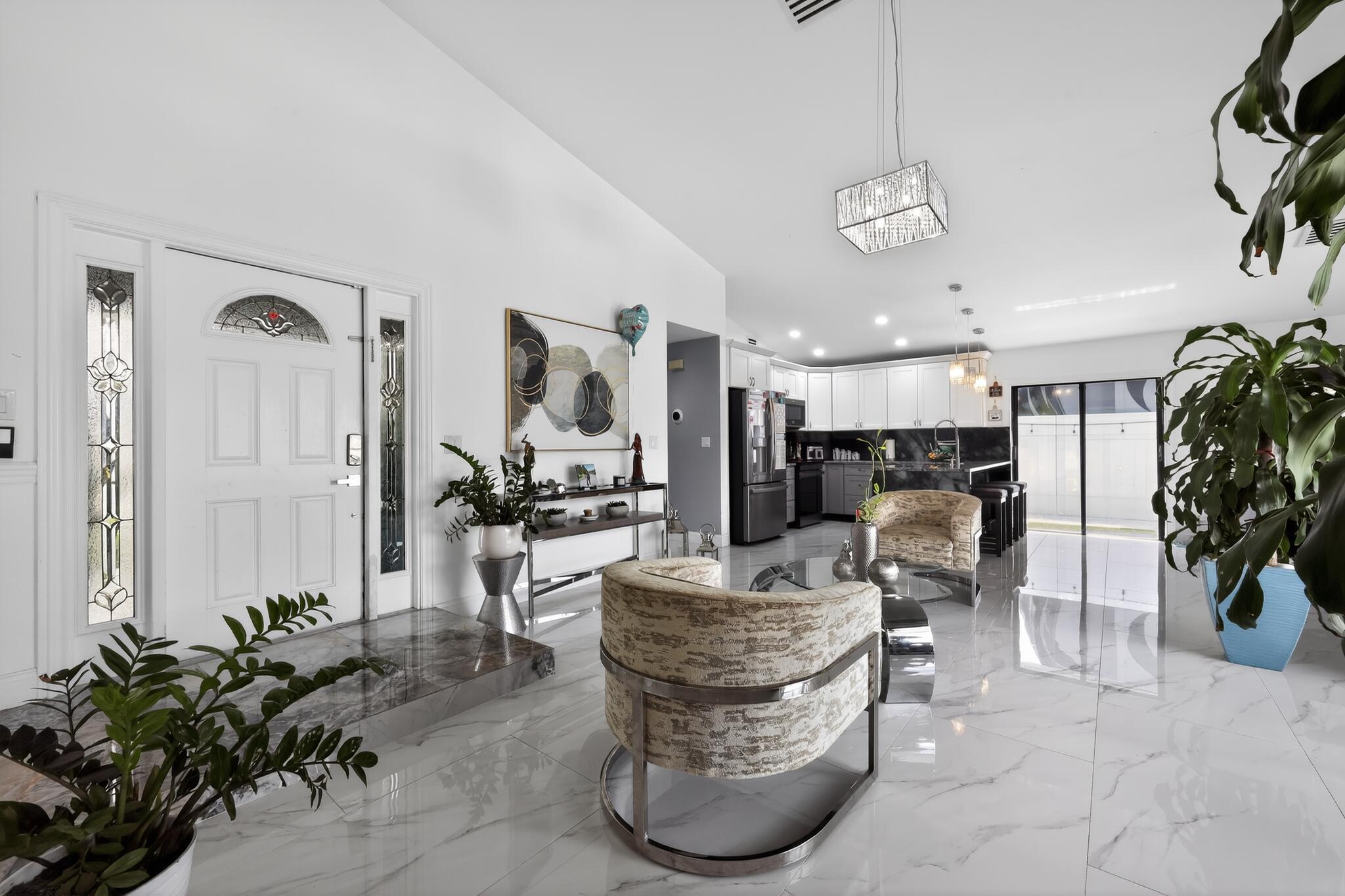 11423 Whisper Sound Drive Boca Raton, FL 33428 - Photo 16 of 39 13_11423_Whisper_Sound_Dr-Living_room-00