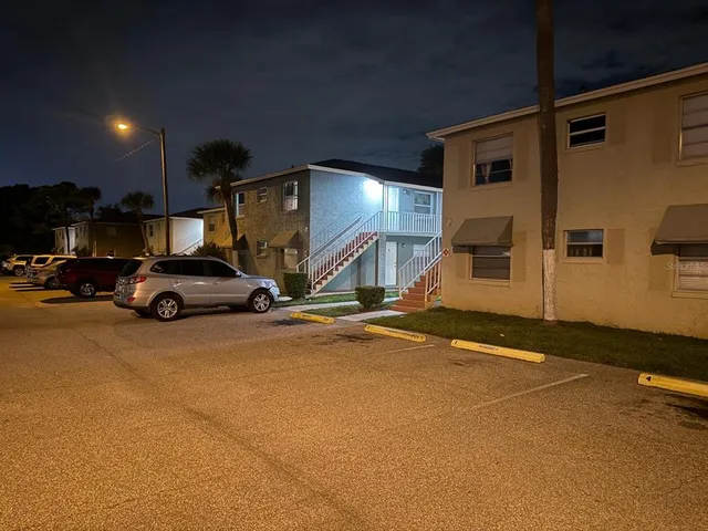 a view of a car park in front of house