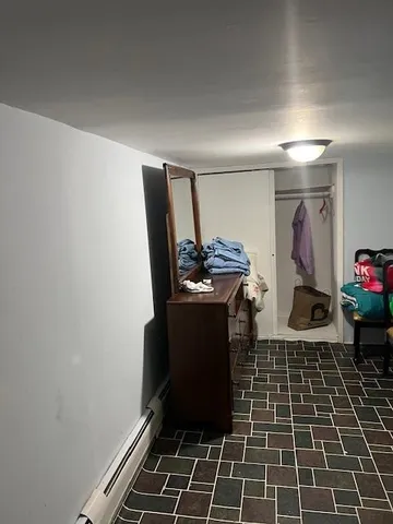 a living room with furniture and stairs