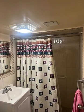 a kitchen with cabinets a sink and appliances