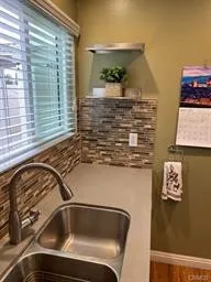 a bathroom with a sink and a window