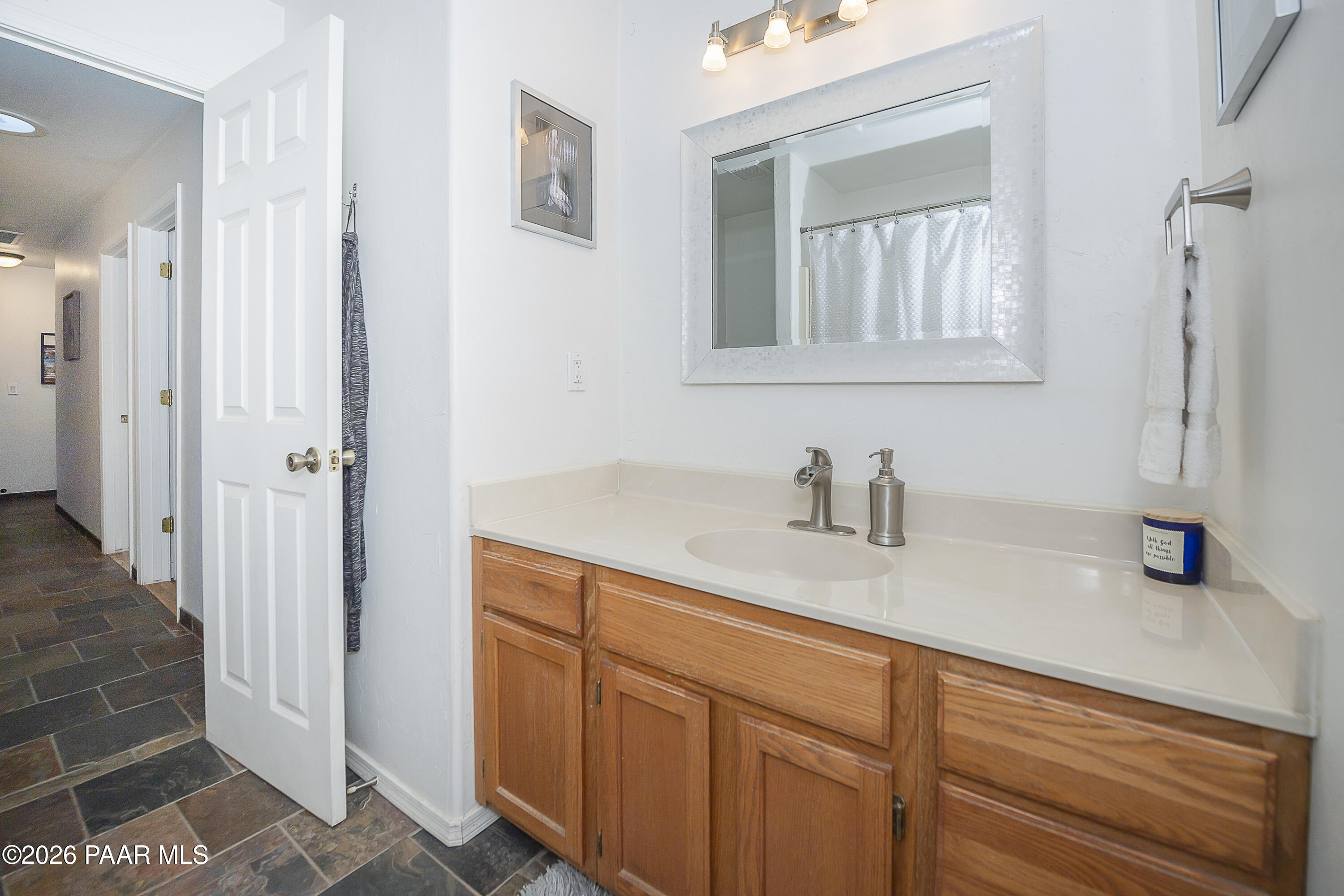 6565 Musgrove Road Skull Valley, AZ 86338 - Photo 24 of 65 a bathroom with a sink and a mirror